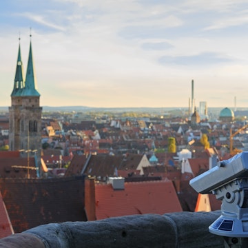 Telescope in the Nuremberg castle, view of the city, church, sky, clouds