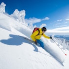 A skier in British Columbia in Canada in bright sunshine.