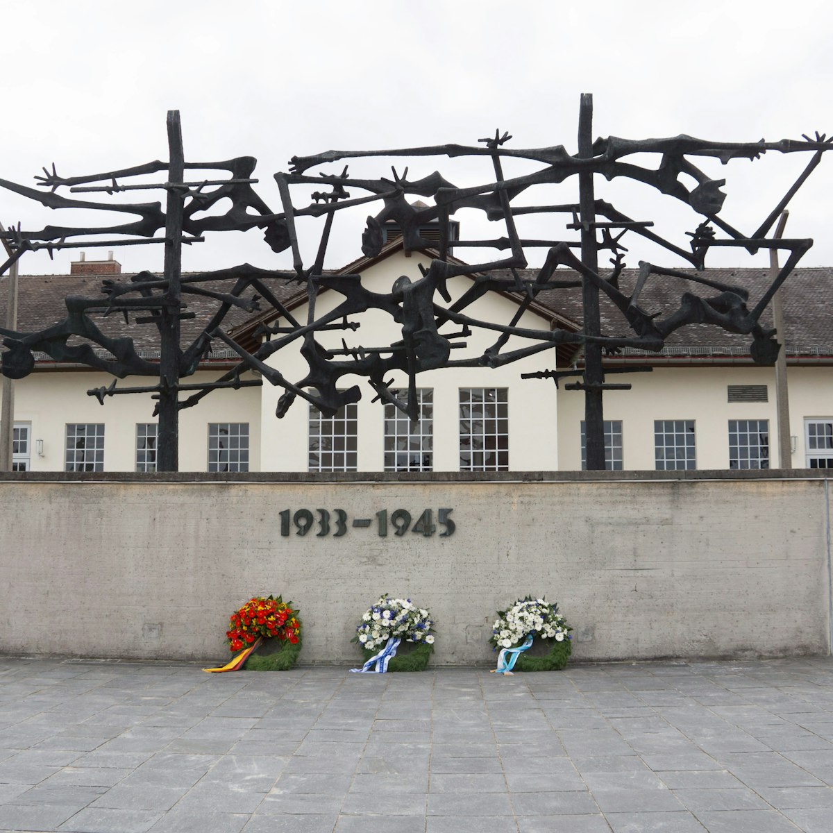 Munich/Germany-September 8 2017:.Exterior of camp facilities with memorial sculpture and wall,  at Dachau Concentration Camp, Munich, Germany.; 
KZ-Gedenkstätte Dachau
Shutterstock ID 760718488; your: Bridget Brown; gl: 65050; netsuite: Online Editorial; full: POI Image Update
