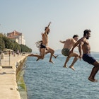 ZADAR, CROATIA - SEPTEMBER 2018. Group of courageous people jumping into harbour sea of Zadar, Croatia.
1064158618
Getty,  RFC,  action,  active,  adriatic,  children,  diving,  extreme,  fearless,  free,  friends,  group,  happy,  high,  holiday,  jump,  kids,  lifestyle,  man,  mediterranean,  ocean,  outdoor,  overcome,  person,  recreation,  scary,  swim,  vacation,  young,  multi ethnic,  Adult,  City,  Male,  Man,  Path,  People,  Person,  Photography,  Portrait,  Shorts,  Summer,  Swimwear,  Water,  Waterfront