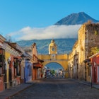 Cityscape of the main street and yellow Santa Catalina arch in the historic city center of Antigua at sunrise with the Agua volcano, Guatemala.
1137146624
Cityscape of the main street and yellow Santa Catalina arch in the historic city center of Antigua at sunrise with the Agua volcano, Guatemala.