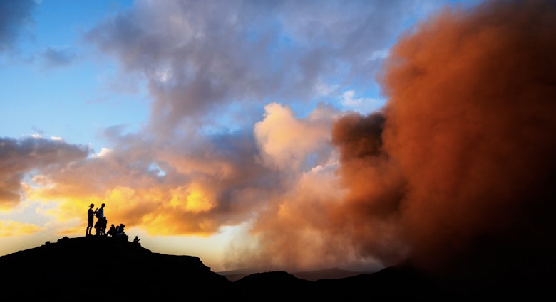 Mt Yasur Volcano, Tanna, Vanuatu
528077207
Tourists watching Mt Yasur volcano. Tanna, Vanuatu - stock photo
Silhouettes of tourists watching eruptions in the crater of the active Mt Yasur Volcano on Tanna Island, Tafea, Vanuatu. This volcano is continually active at a low to moderate level. Tourists may approach the rim to view the crater eruptions when the activity level is not dangerously high.