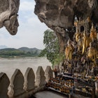 View of the Mekong River and many golden and wooden Buddha statues and religious offerings inside the Tham Ting Cave at the famous Pak Ou Caves near Luang Prabang in Laos.
956152240
View of the Mekong River and many golden and wooden Buddha statues and religious offerings inside the Tham Ting Cave at the famous Pak Ou Caves near Luang Prabang in Laos.