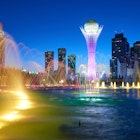 Astana is the capital of Kazakhstan, shown with colorfully lit water spraying.