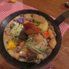 Traditional dish of dumplings -- both potato and bread versions -- at Ehrbar Weinstube, Frickenhausen. The dish is served in a small, iron fying pan and decorated with edible flowers and thyme