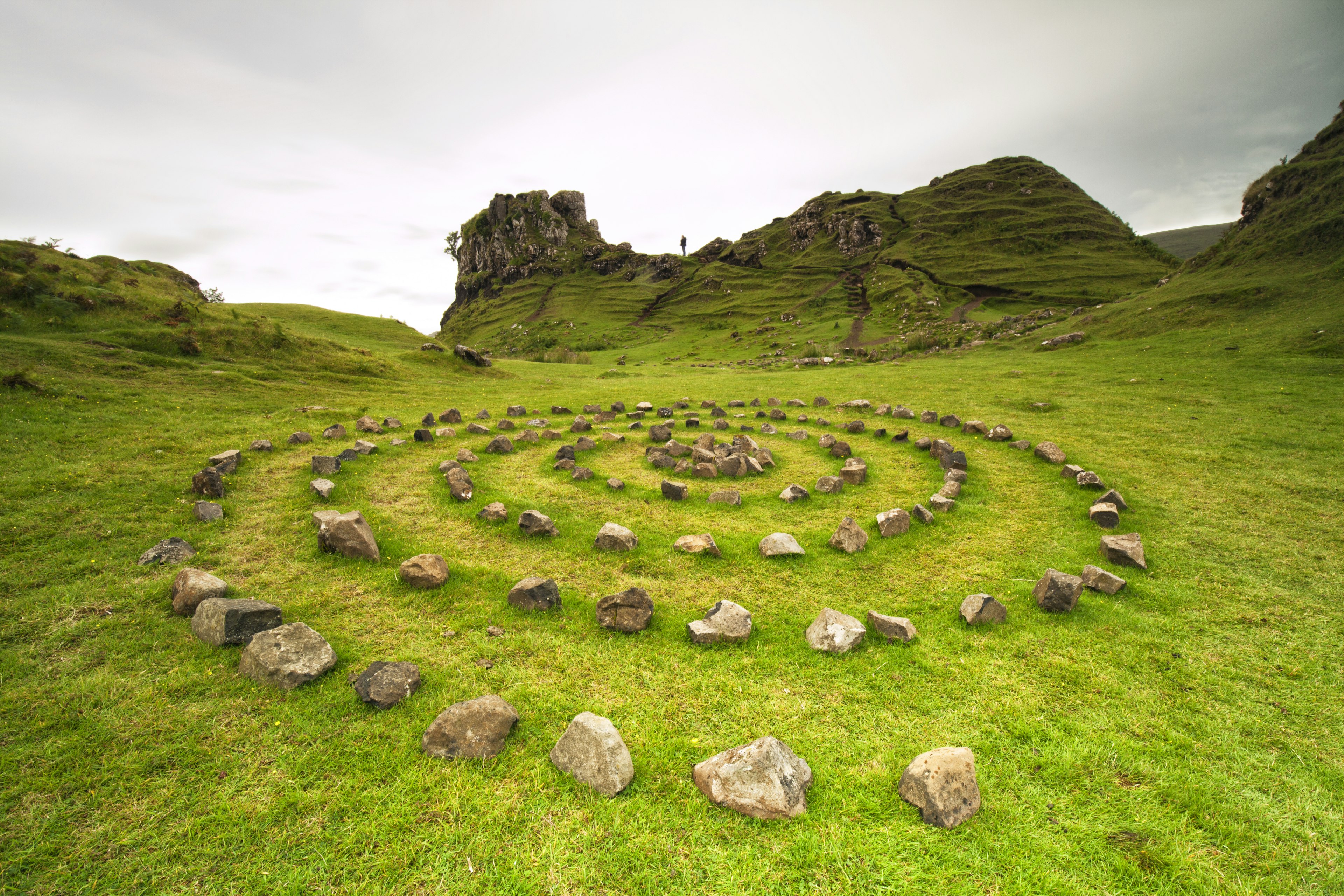 A mystical-looking stone circle in lush green grass