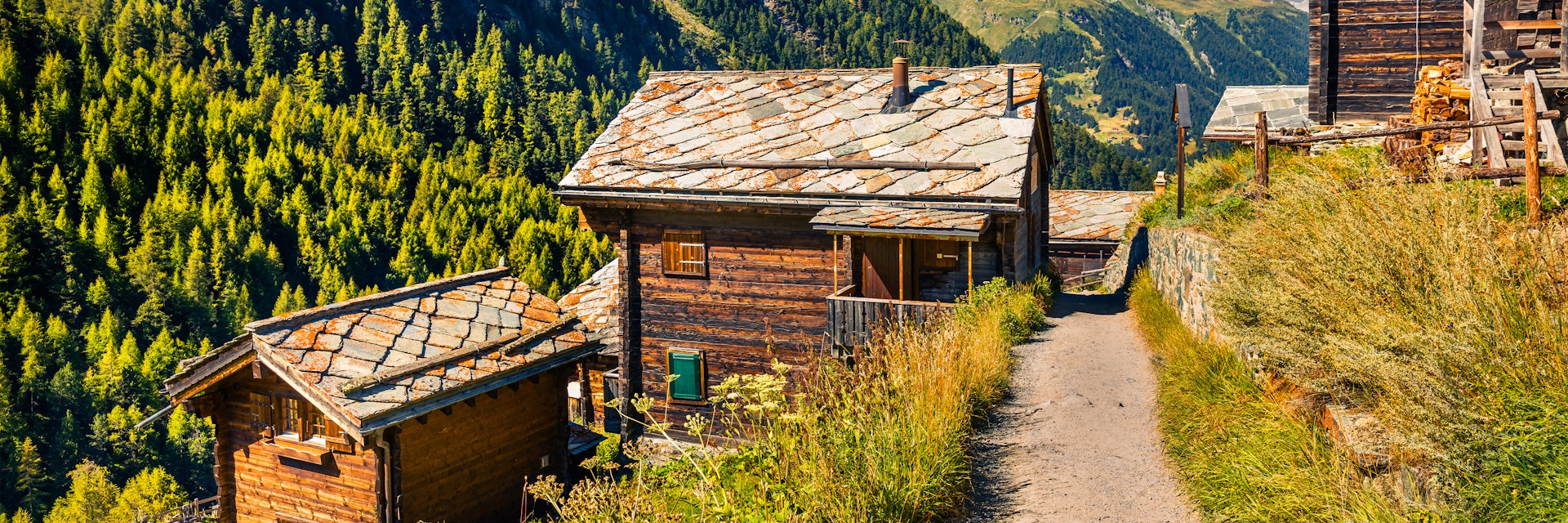 Sunny summer morning in Zermatt village with Matterhorn (Monte Cervino, Mont Cervin) peak on backgroud. Beautiful outdoor scene in  Swiss Alps, Valais canton, Switzerland, Europe.