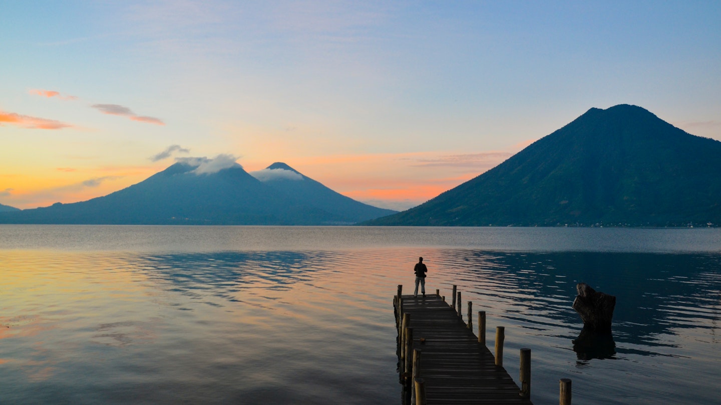 Observing the incredible beautiful sunrise at Lake Atitlan in Guatemala.  License Type: media  Download Time: 2022-03-29T09:35:18.000Z  User: AMccarthy_lonelyplanet  Is Editorial: No  purchase_order: