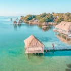 Aerial view of a Couple in Bacalar pier, Riviera Maya, Mexico  License Type: media  Download Time: 2023-06-15T03:53:23.000Z  User:   Is Editorial: No  purchase_order:  56530/Global Publishing-WIP