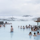 Blue lagoon, Iceland - February 20, 2016: People in SPA  are drinking cocktails near  a cafe in the swiming pool, Blue lagoon - a geothermal bath resort in the south of Iceland, in winter.
amazing, bath, bathing, blue, cafe, care, cocktail, documentary, editorial, geology, geothermal, girl, happy, health, holiday, hot, iceland, icelandic, lagoon, lake, lava, lifestyle, minerals, mud, nordic, people, pool, recreation, relaxing, resort, sightseeing, skin, skincare, spa, spring, therapy, thermal, tourism, tourist, travel, treatment, vacation, volcanic, volcanism, volcano, warm, water, wellness, winter, woman