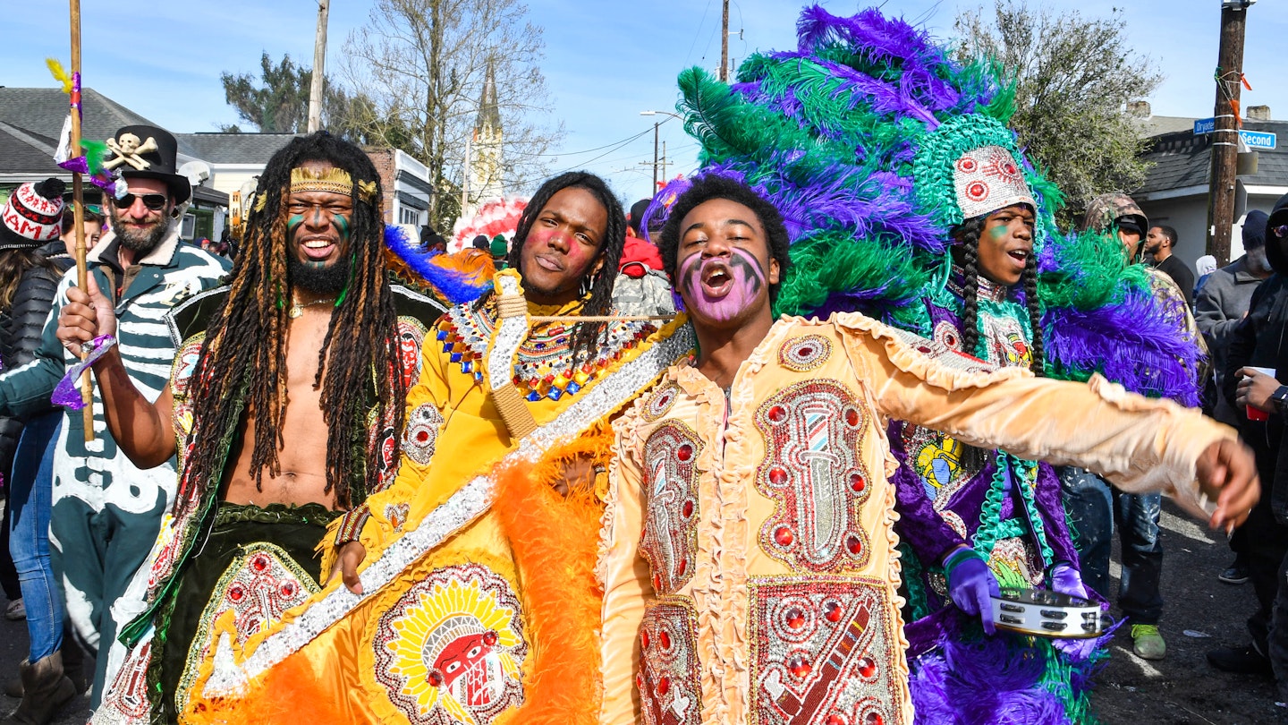 NEW ORLEANS, LOUISIANA - MARCH 05: (L-R) Lawrence Boudreaux, Marwan Pleasant, Jwan Boudreaux,  and Nigel Pleasant of the Golden Eagles Mardi Gras Indians face off with another tribe on March 5, 2019 in New Orleans, Louisiana. (Photo by Erika Goldring/Getty Images)