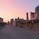Bucket list view: sunset at Bukhara Kalon Minaret in Uzbekistan. Image by Stephen Lioy / Lonely Planet